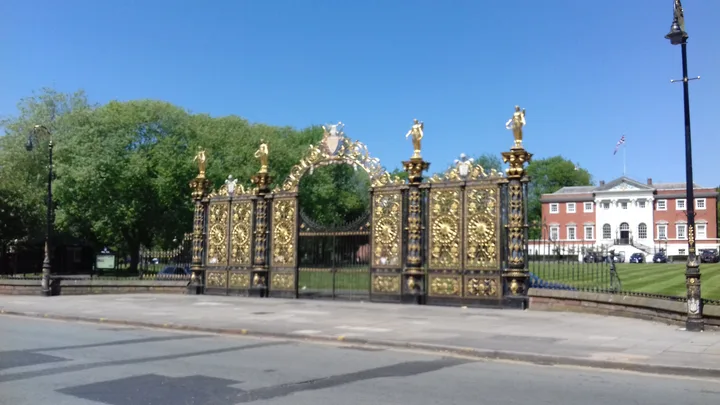 Warrington’s Golden Gates with the Town Hall beyond, under a blue sky